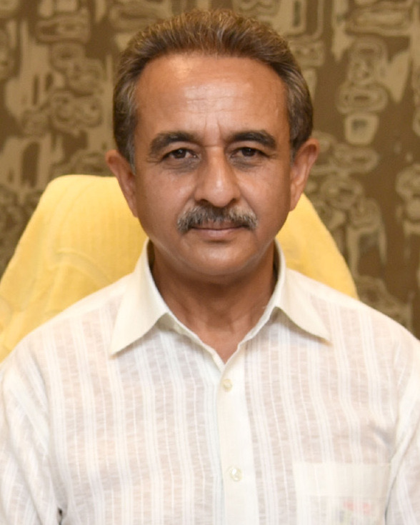 Portrait of Kirtivardhan Singh in a white shirt